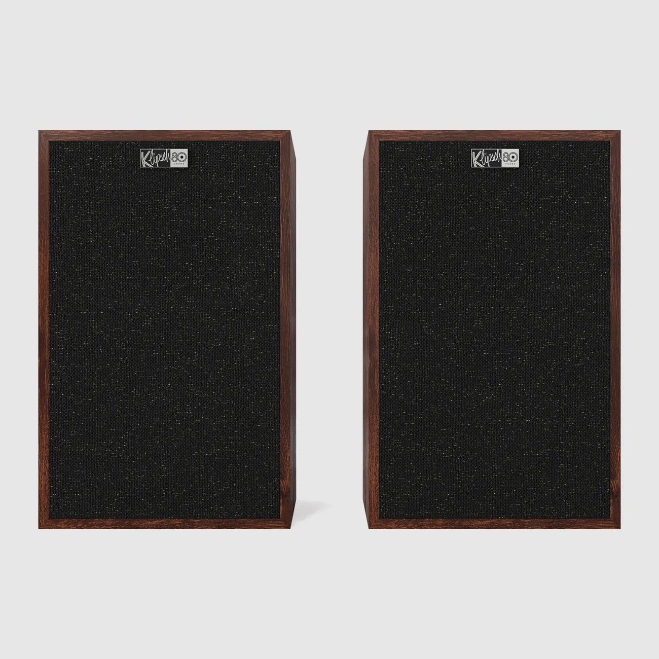 Pair of rectangular Klipsch speakers with black fabric fronts and dark wood frames on a gray background.