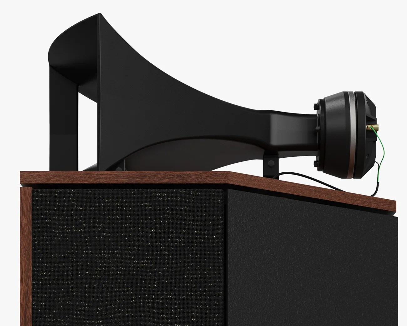 Black horn speaker driver mounted on a wooden cabinet with black fabric front panel.