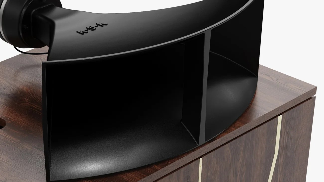 Close-up of a black Klipsch horn speaker mounted on a dark wood cabinet with brass inlay.
