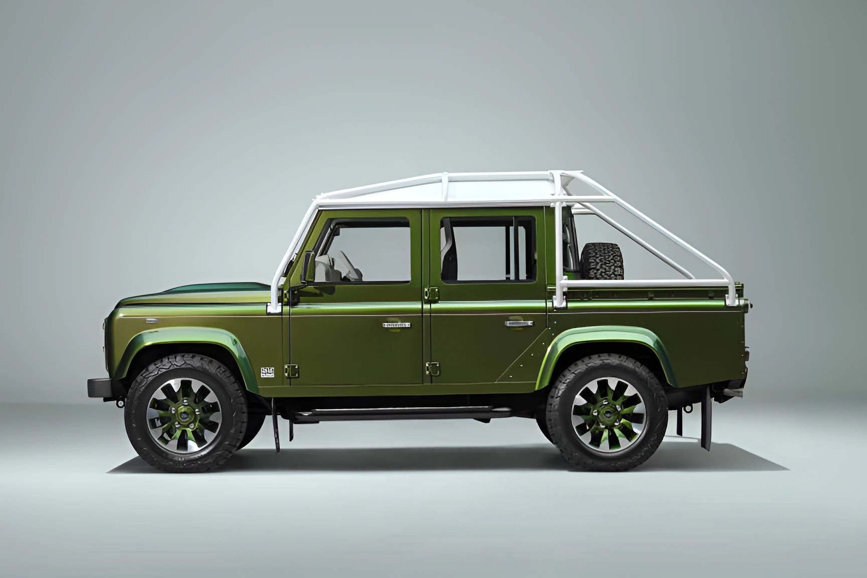 Green off-road vehicle with white roll cage and spare tire in the truck bed.