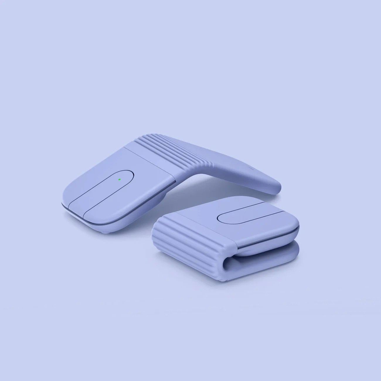 Two folded, light purple, ribbed, compact electronic devices with a small green indicator light on one, placed on a matching light purple surface.