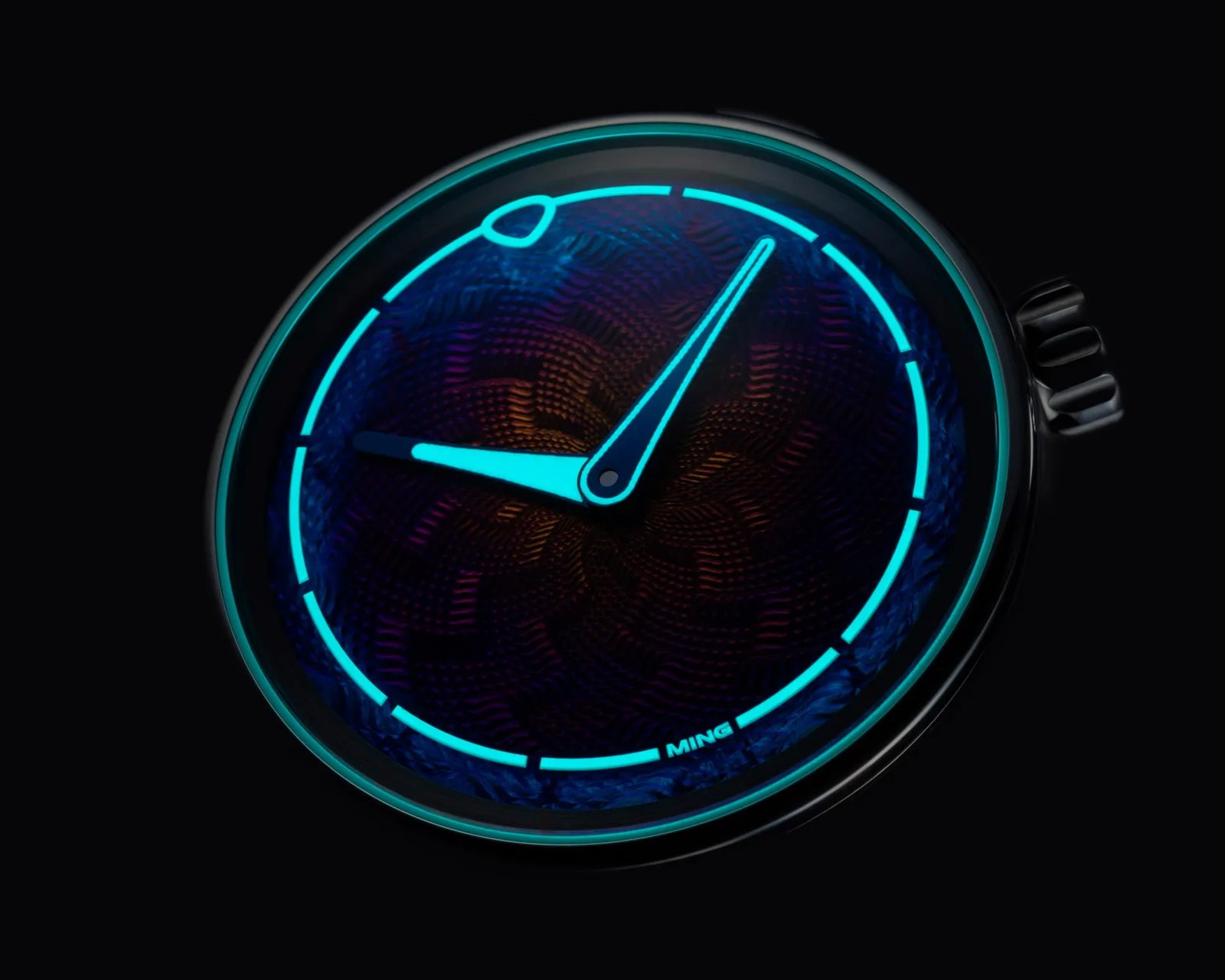 Close-up of a wristwatch face with glowing blue hands and hour markers on a textured dark dial.