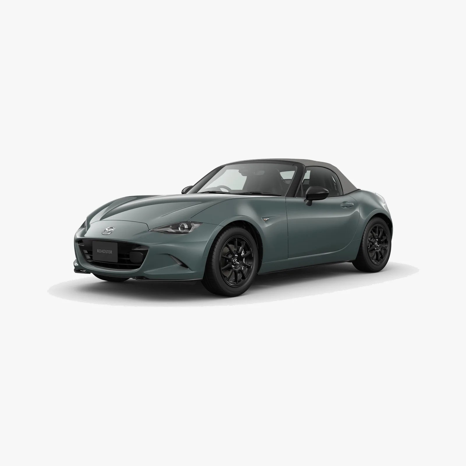 Green Mazda MX-5 Miata convertible with black soft top and black wheels on a white background.