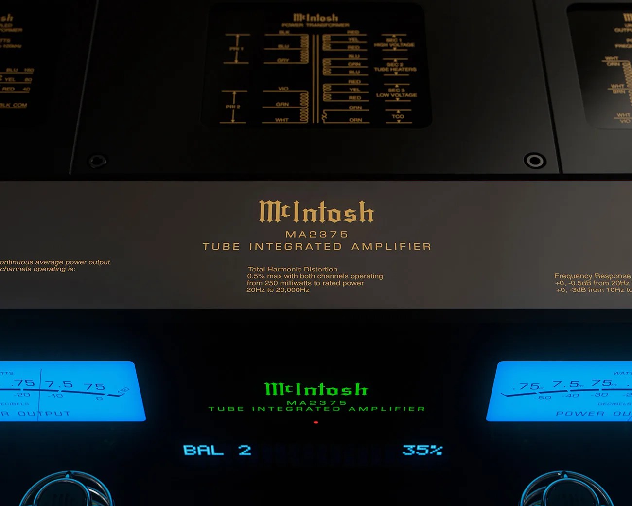 Close-up of McIntosh MA2375 tube integrated amplifier with illuminated blue power output meters and green logo display.