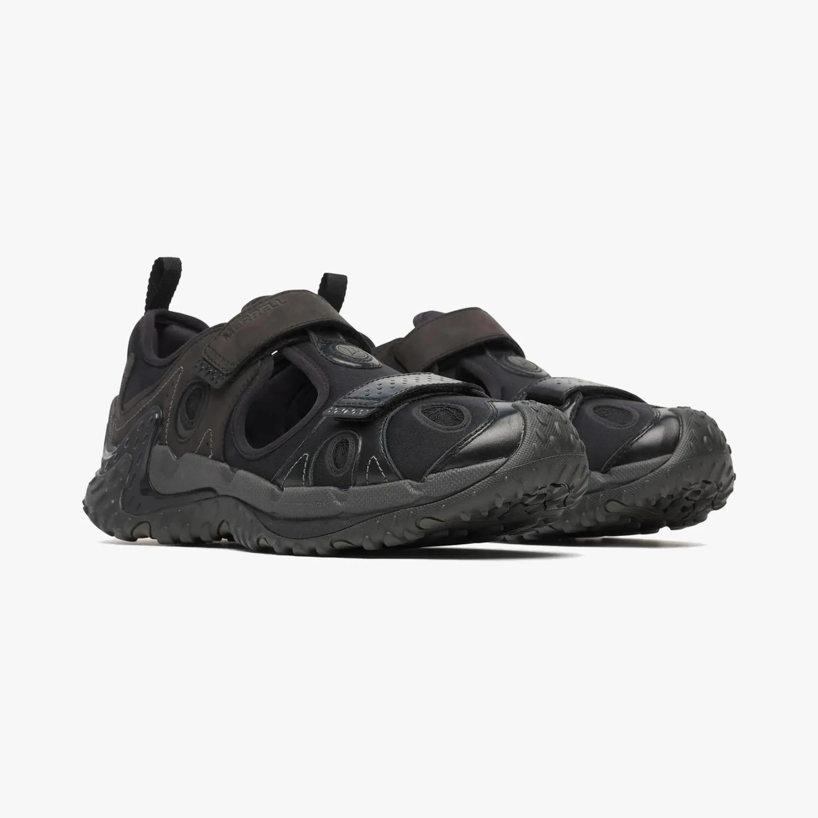 Pair of black Merrell hiking shoes with rugged soles and adjustable straps.