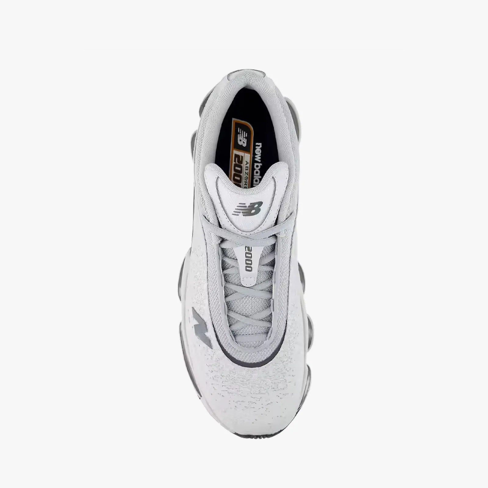 Top view of a white New Balance 2000 sneaker with gray accents and laces.