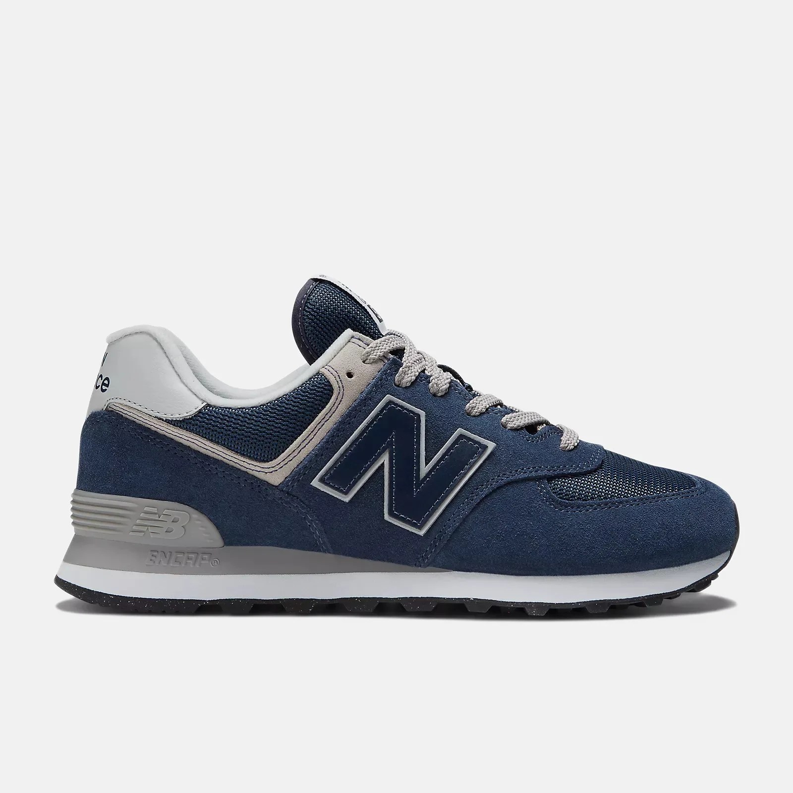 Navy blue and gray New Balance sneaker with suede and mesh upper and gray laces.