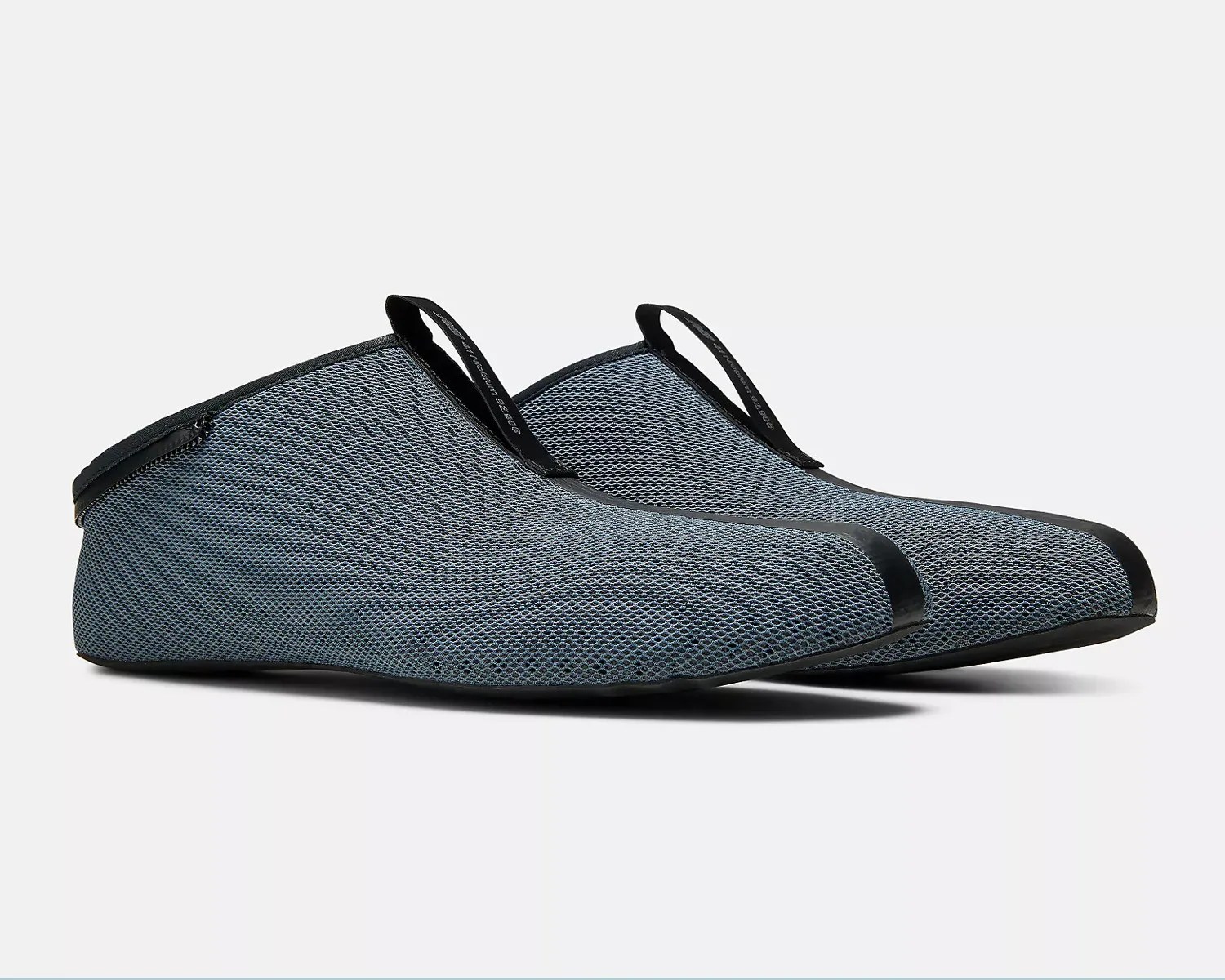 Pair of gray mesh water shoes with black trim and pull tabs on a white background.