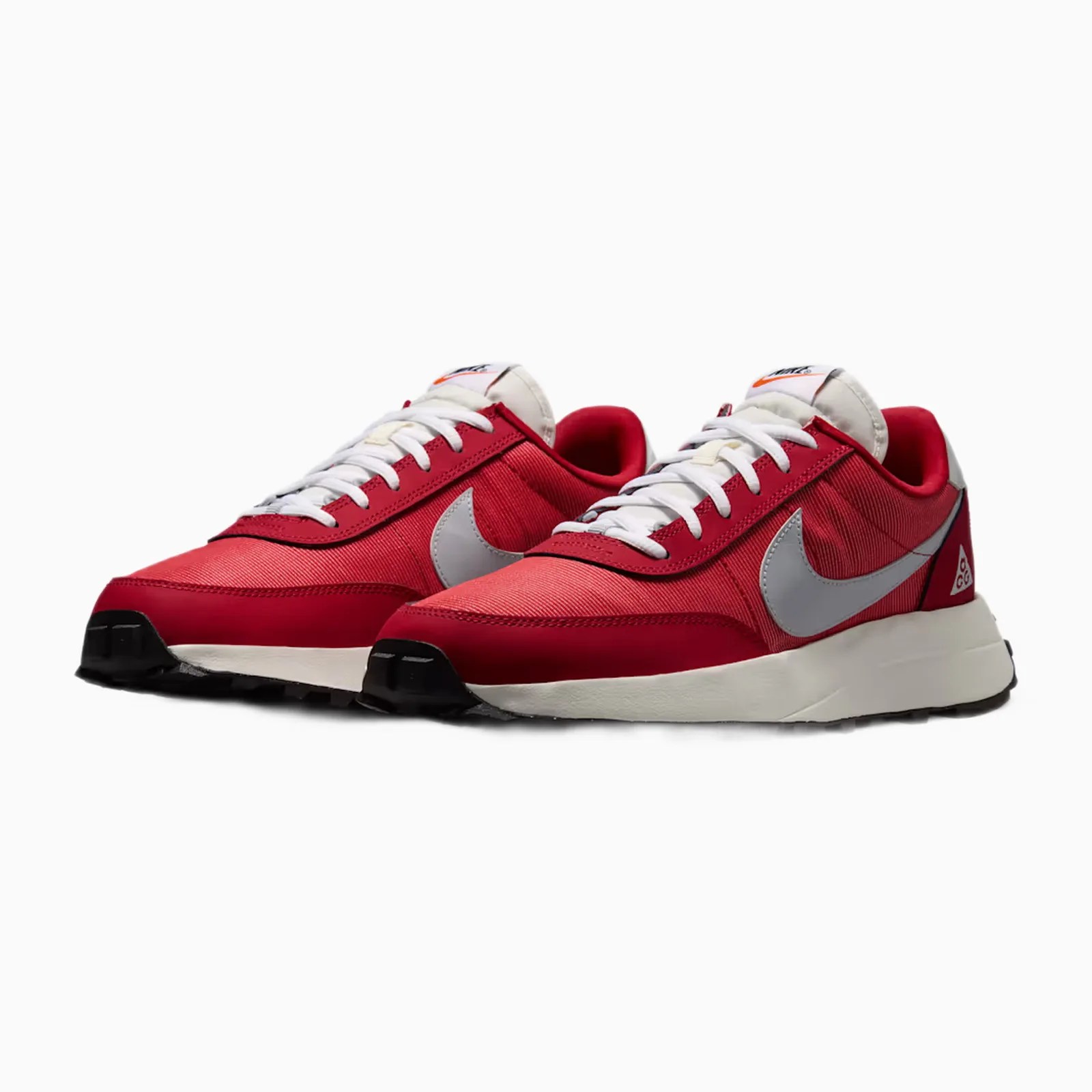 Pair of red Nike sneakers with white laces, gray swoosh logo, and black soles on a white background.
