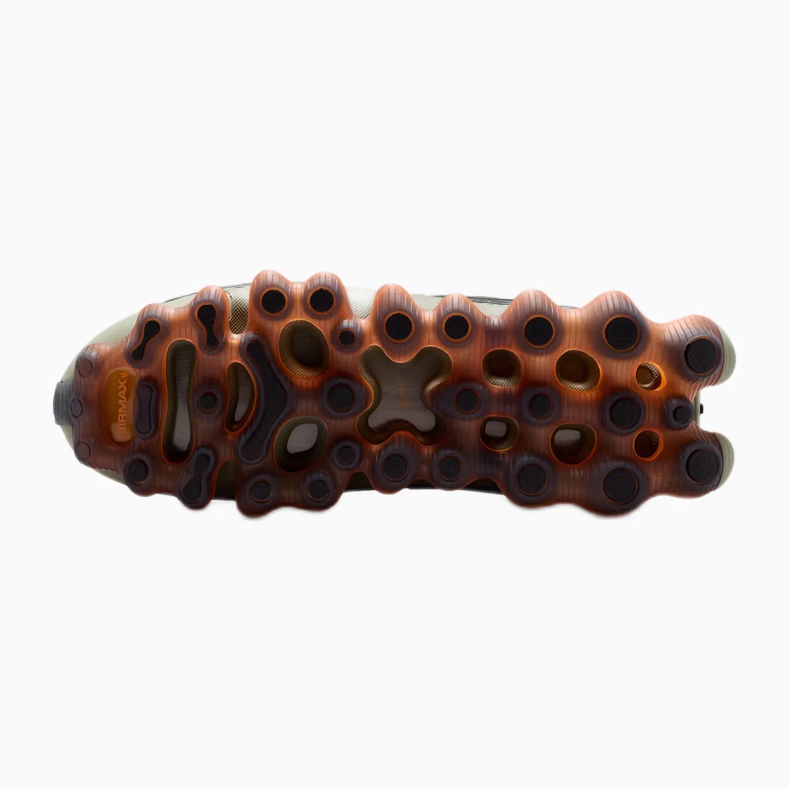 Translucent orange and black Nike Air Max shoe sole with multiple circular and irregular cutouts.