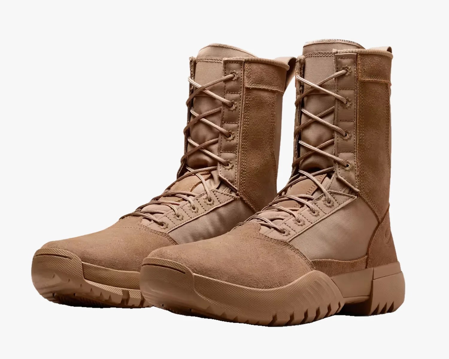Pair of tan suede and fabric tactical boots with thick rubber soles and laces.