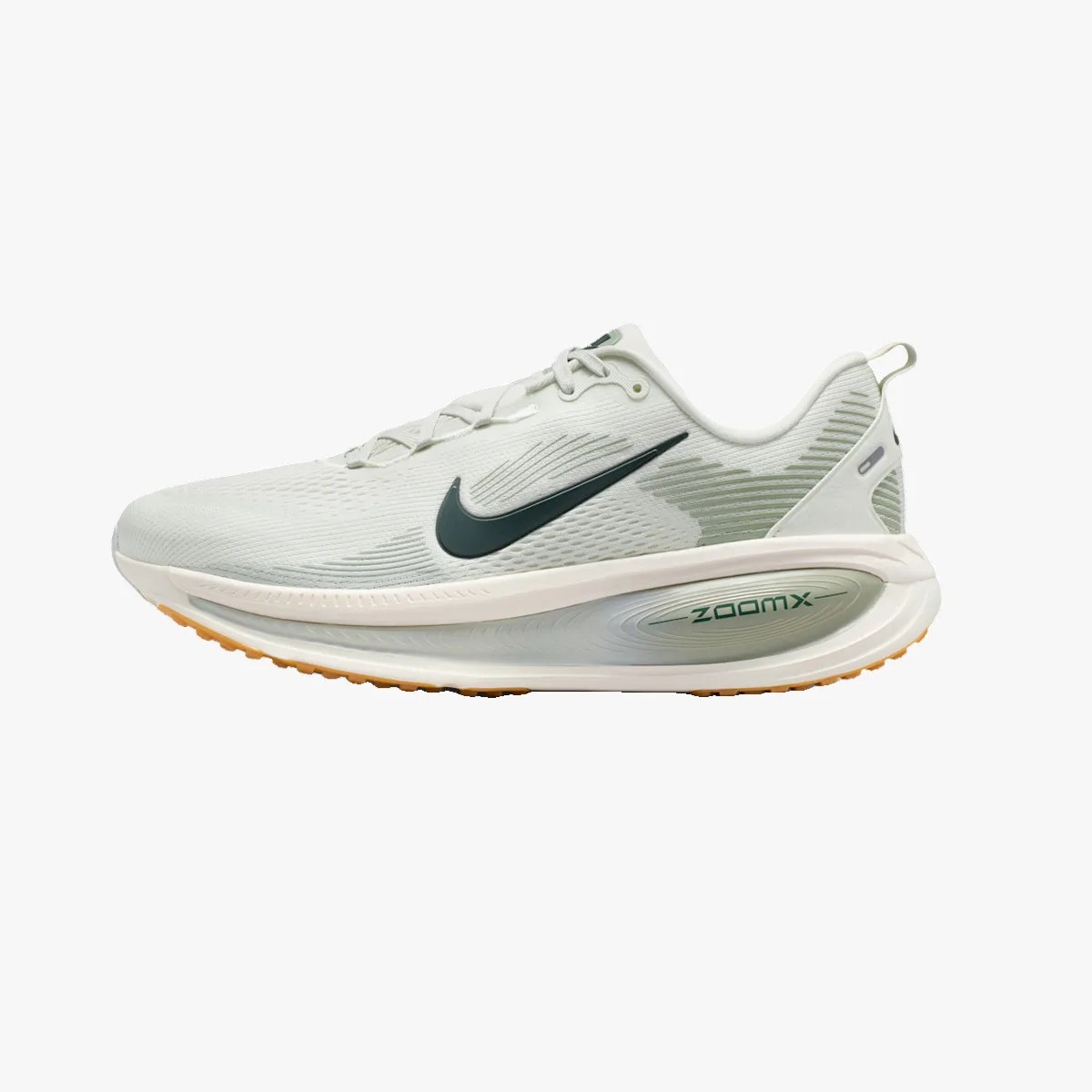 Light gray Nike ZoomX running shoe with dark green swoosh and gum sole.