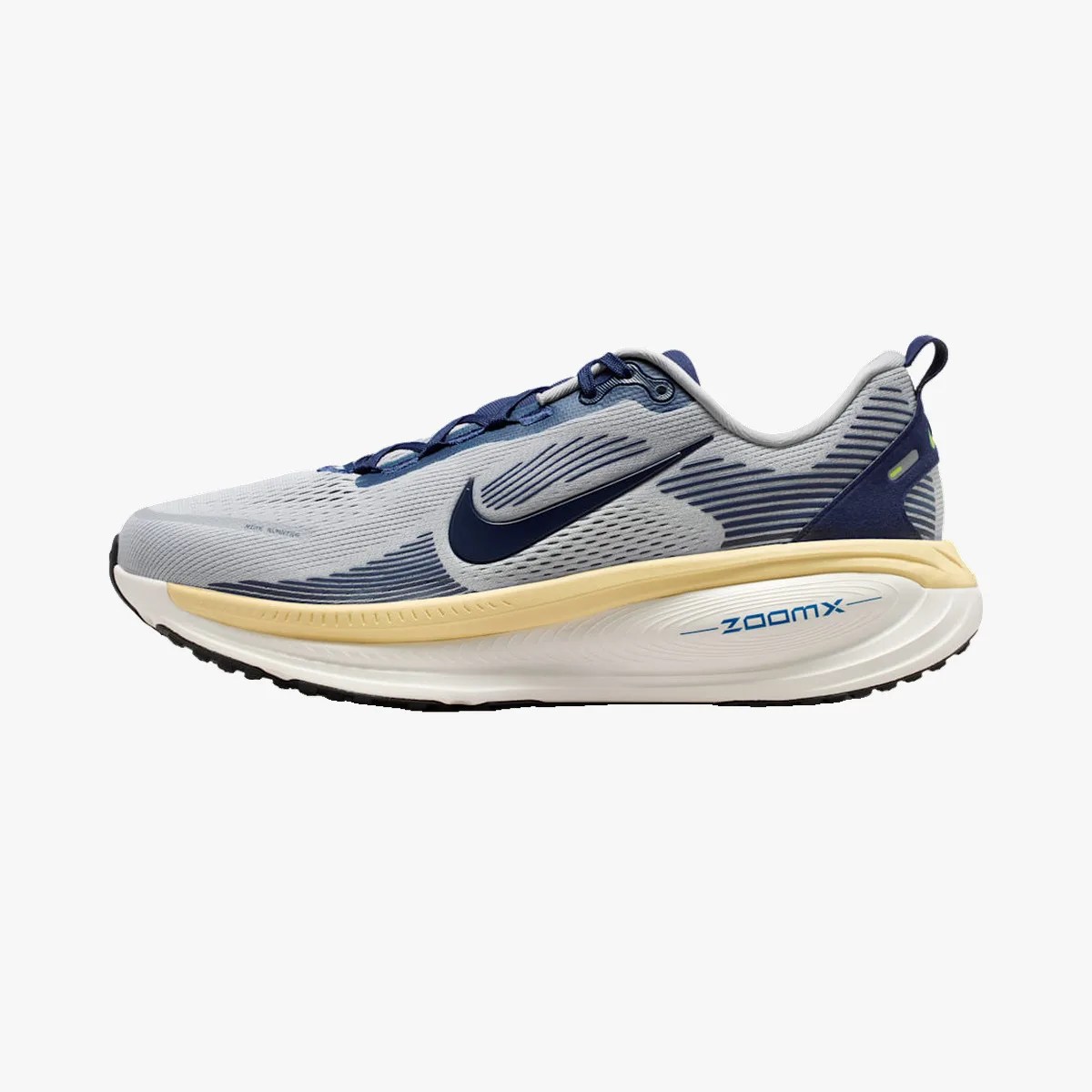 Light gray and navy blue Nike ZoomX running shoe with a thick white and beige sole.