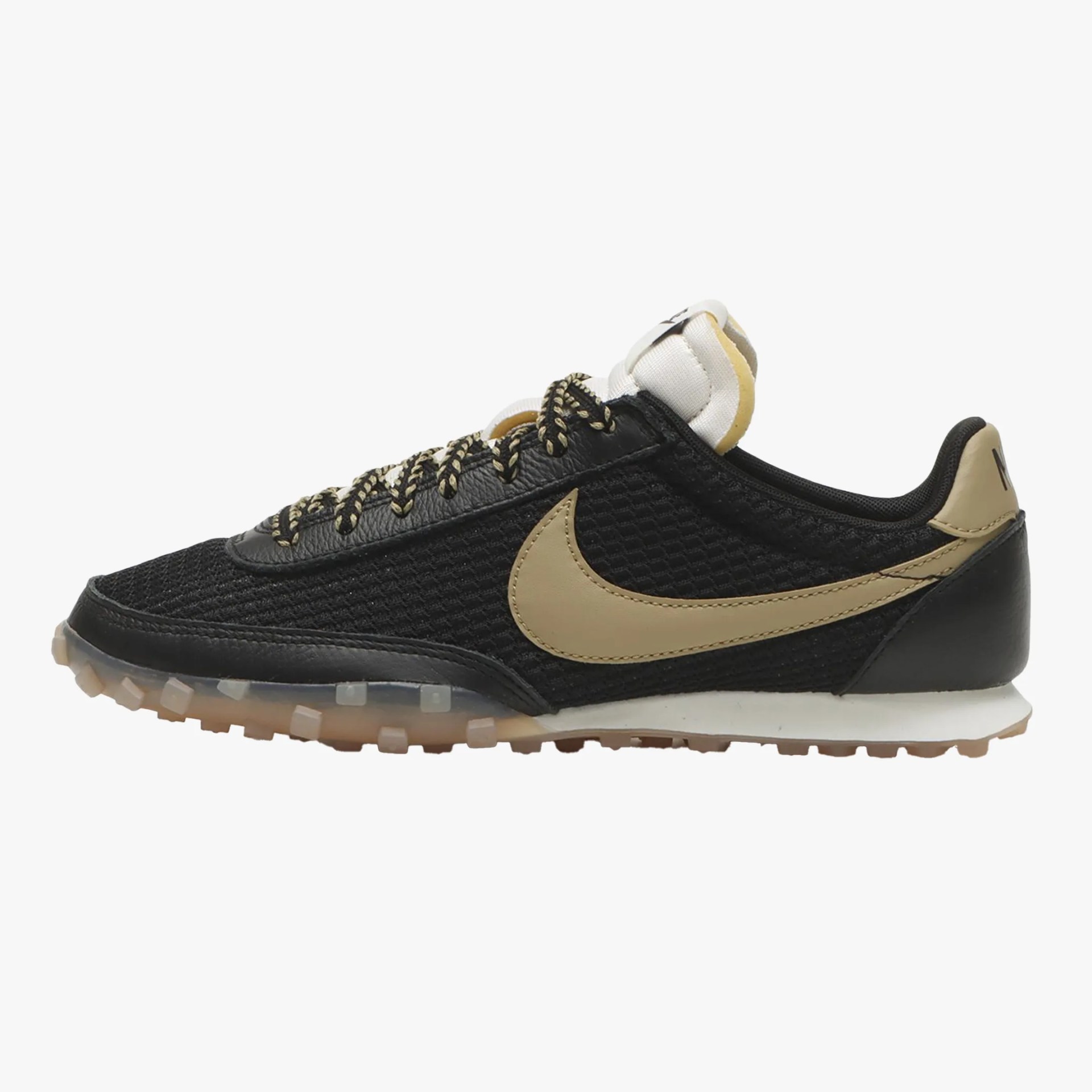 Black and beige Nike sneaker with mesh upper, leather overlays, patterned laces, and translucent rubber sole.