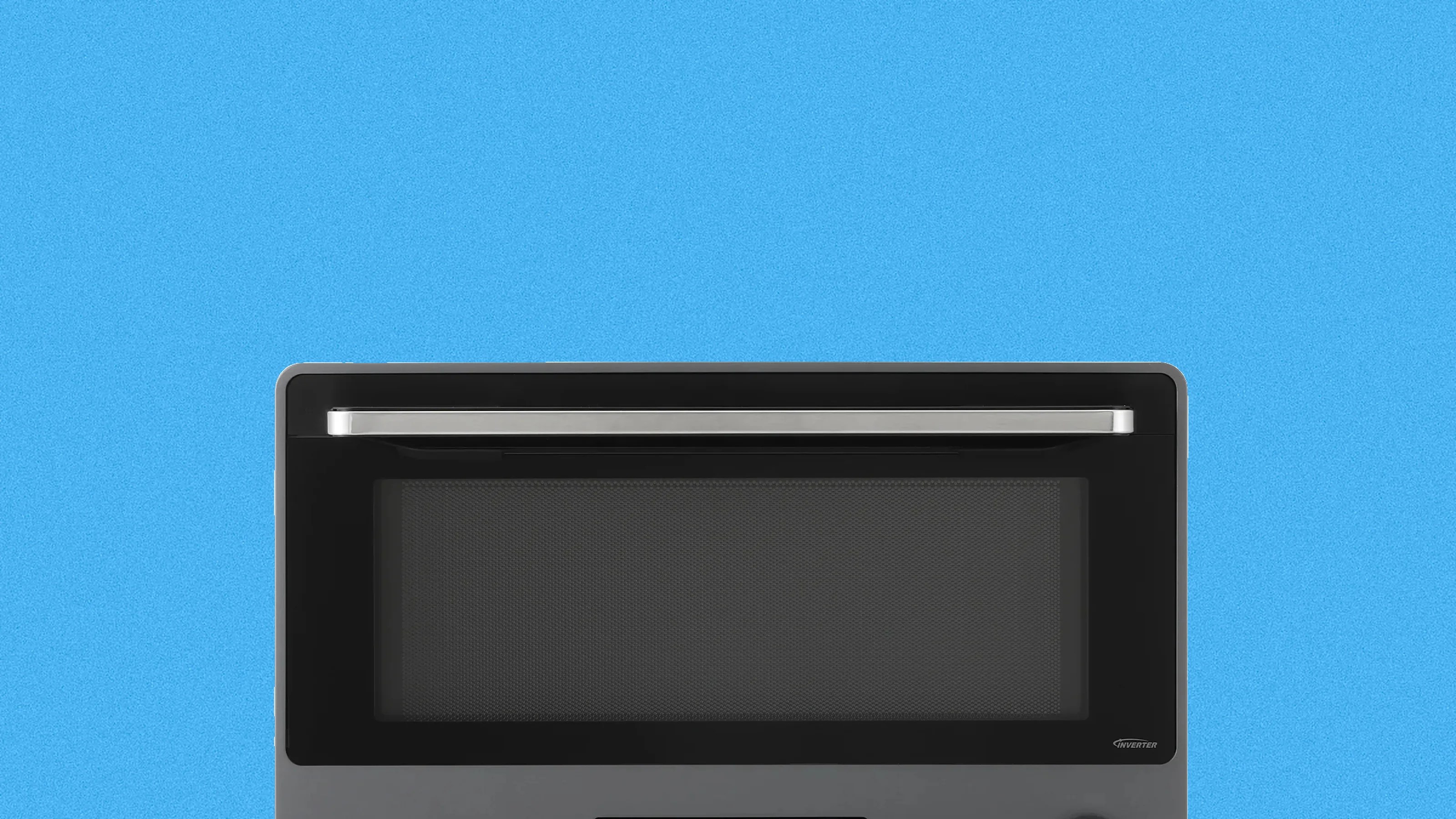 Top portion of a stainless steel microwave oven with a black door and silver handle against a blue background.