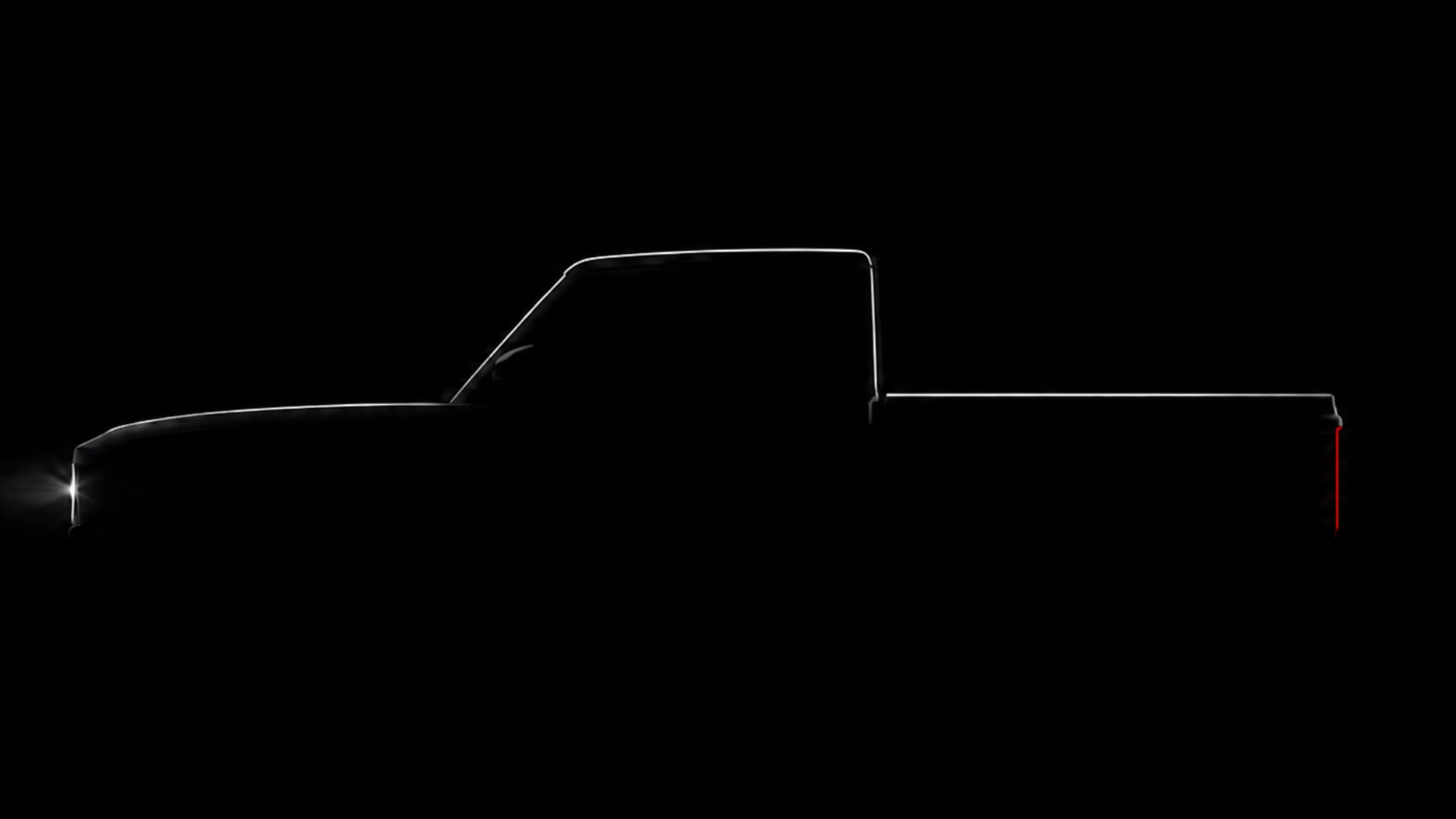 Outline of a pickup truck with illuminated front and rear lights on a black background.