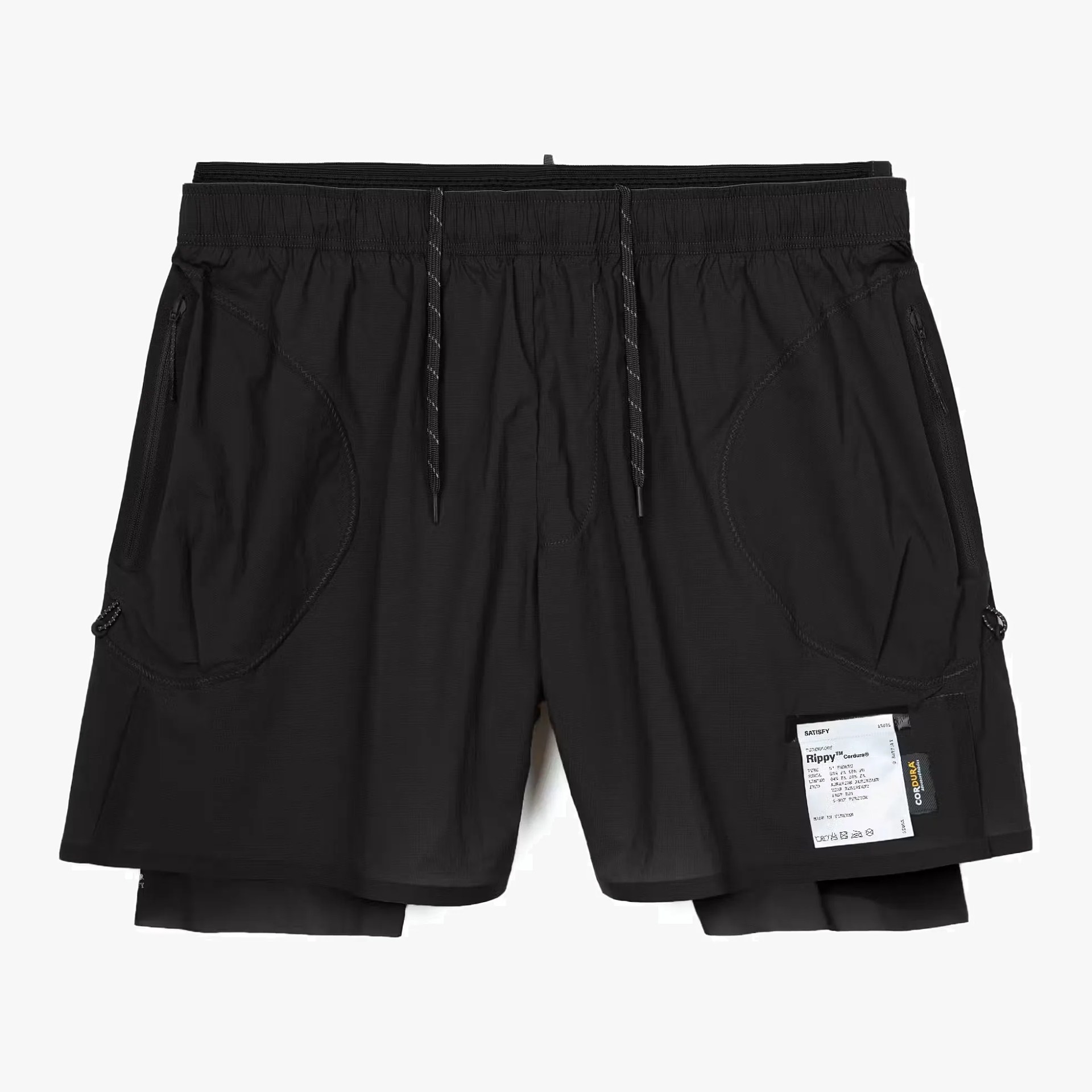 Black layered shorts with elastic waistband, drawstrings, zippered side pockets, and a white Cordura fabric label on the right leg.