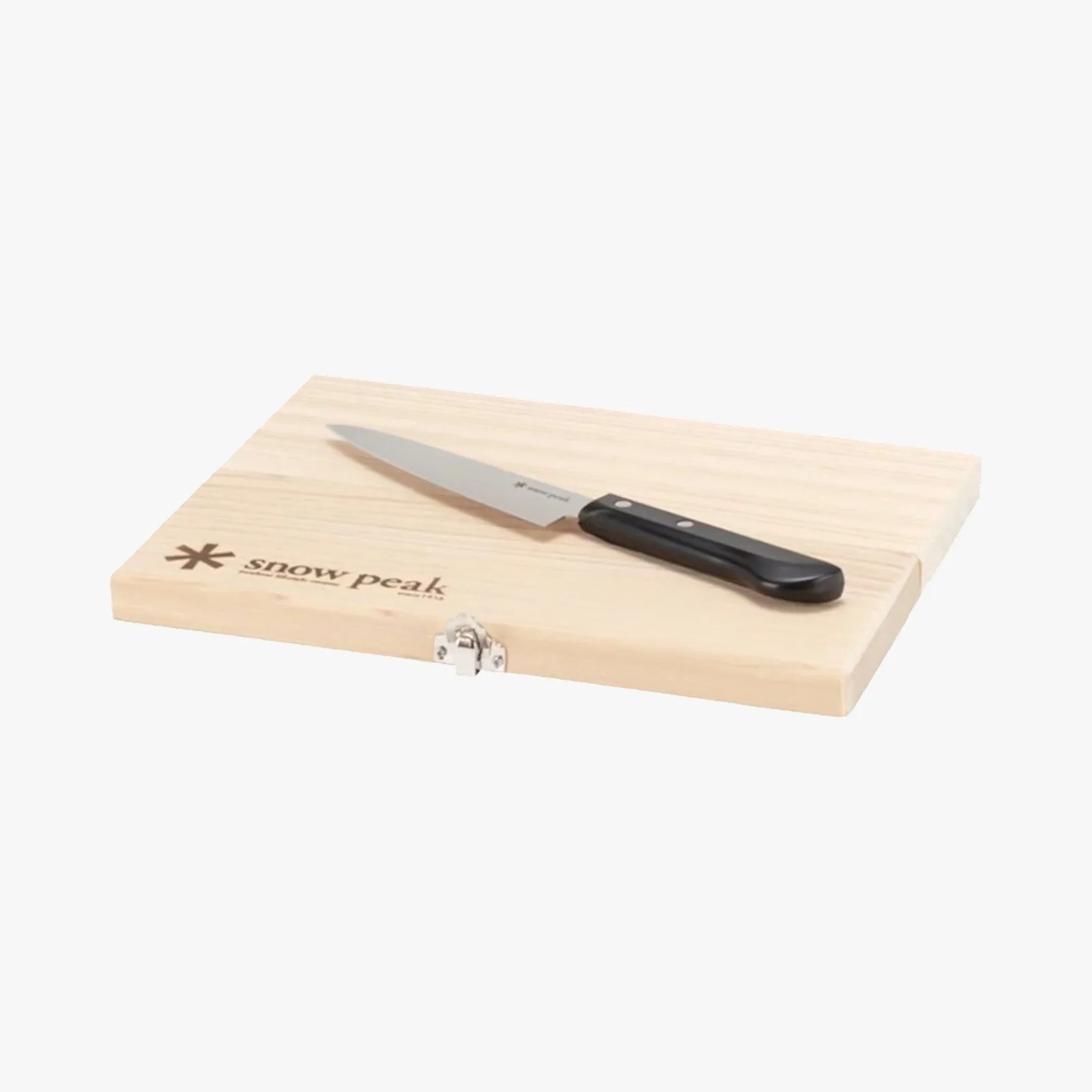 Light wood cutting board with metal latch and black-handled kitchen knife on top.