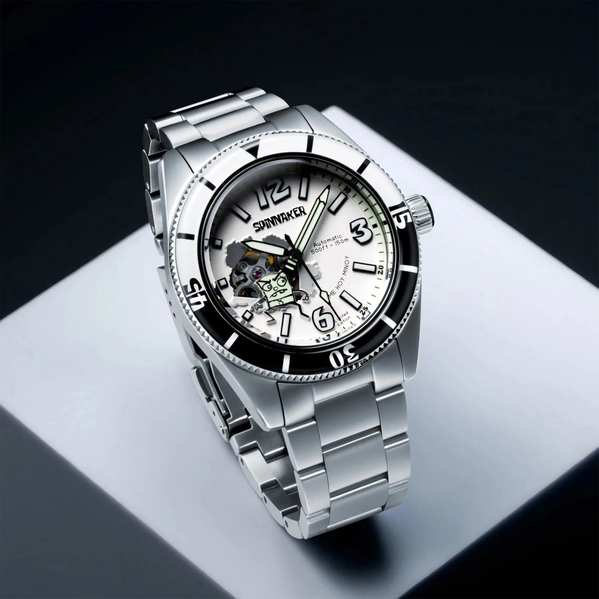 Silver stainless steel Spinnaker wristwatch with white dial and black bezel on a white surface.