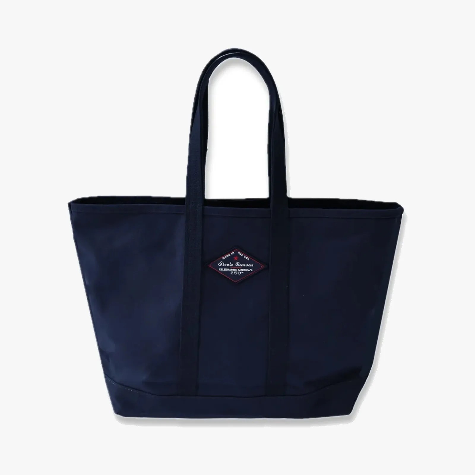 Navy blue canvas tote bag with two handles and a diamond-shaped logo patch on the front.