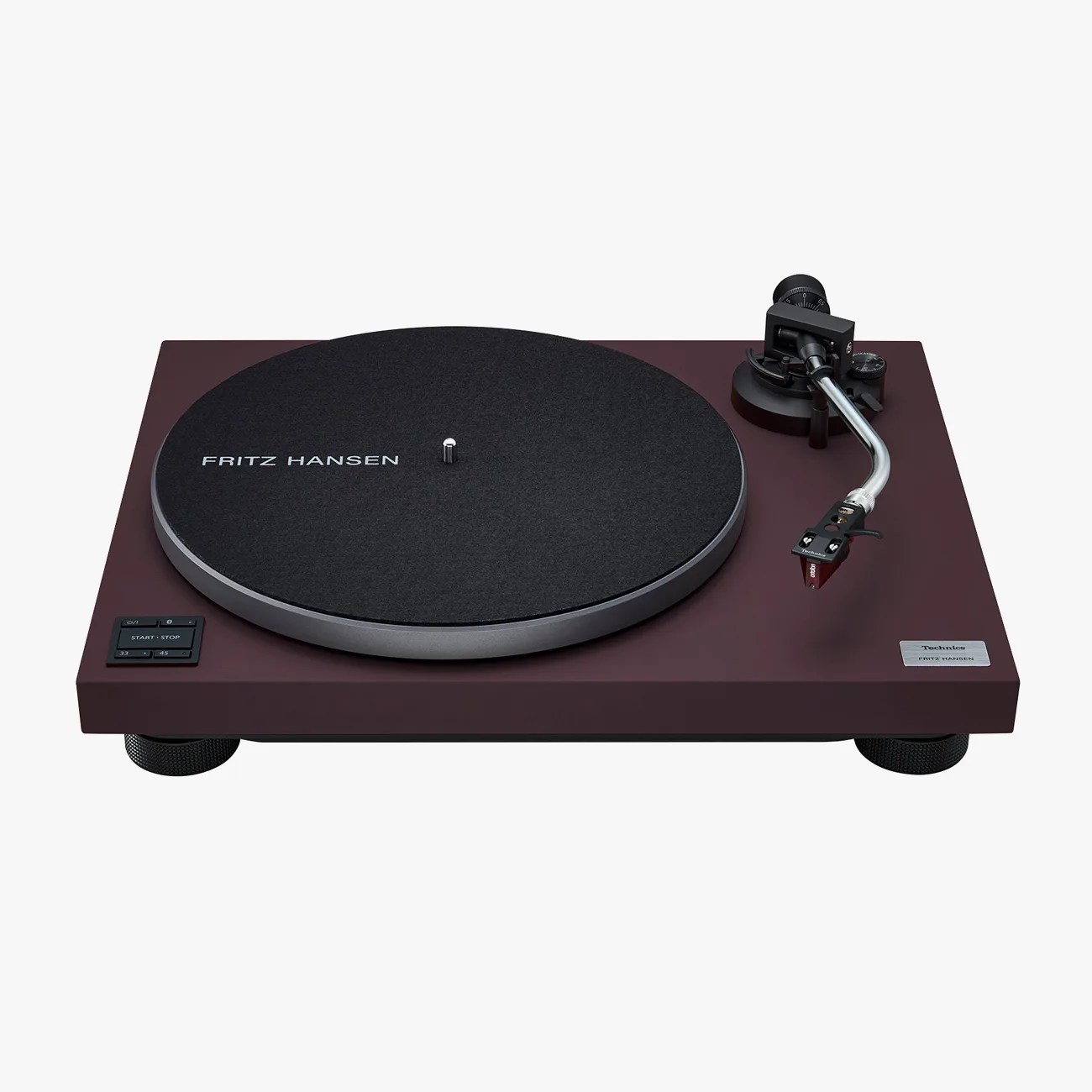 Dark burgundy Technics turntable with black felt platter mat labeled "Fritz Hansen" and silver tonearm.