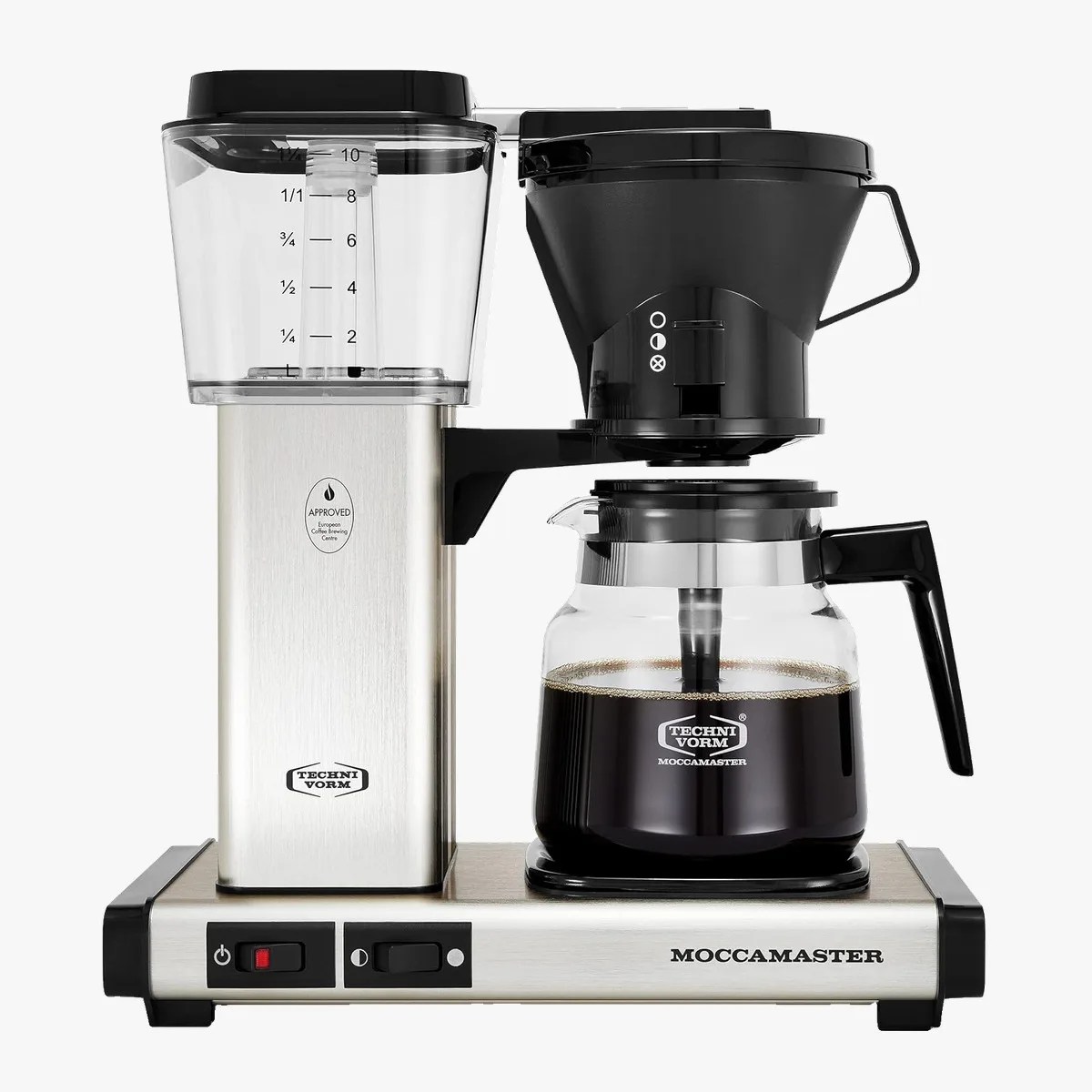 Stainless steel and black Moccamaster coffee maker with glass carafe filled with coffee.