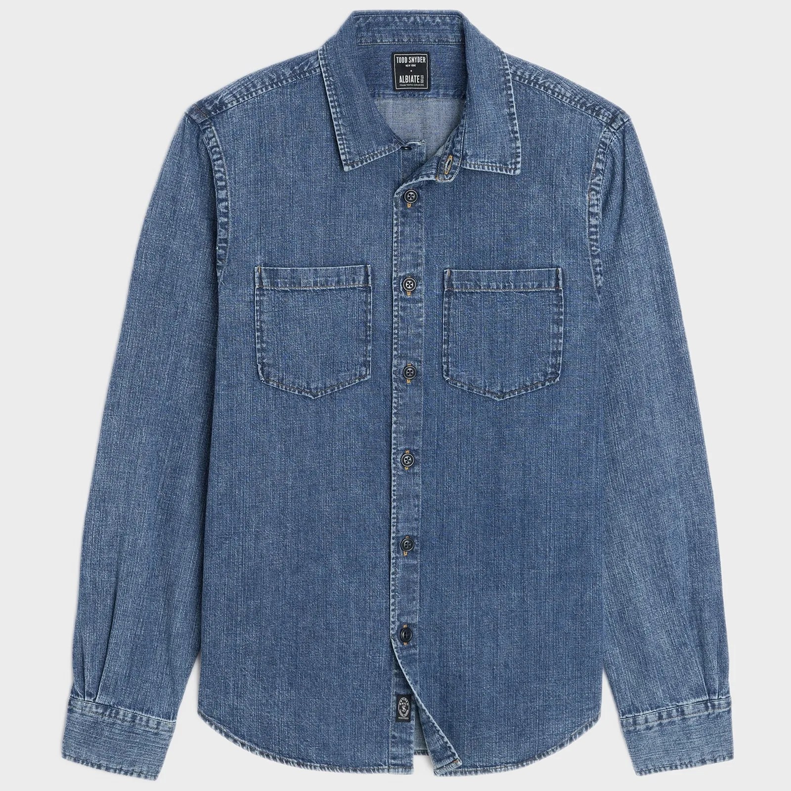 Blue denim button-up shirt with two chest pockets and long sleeves.