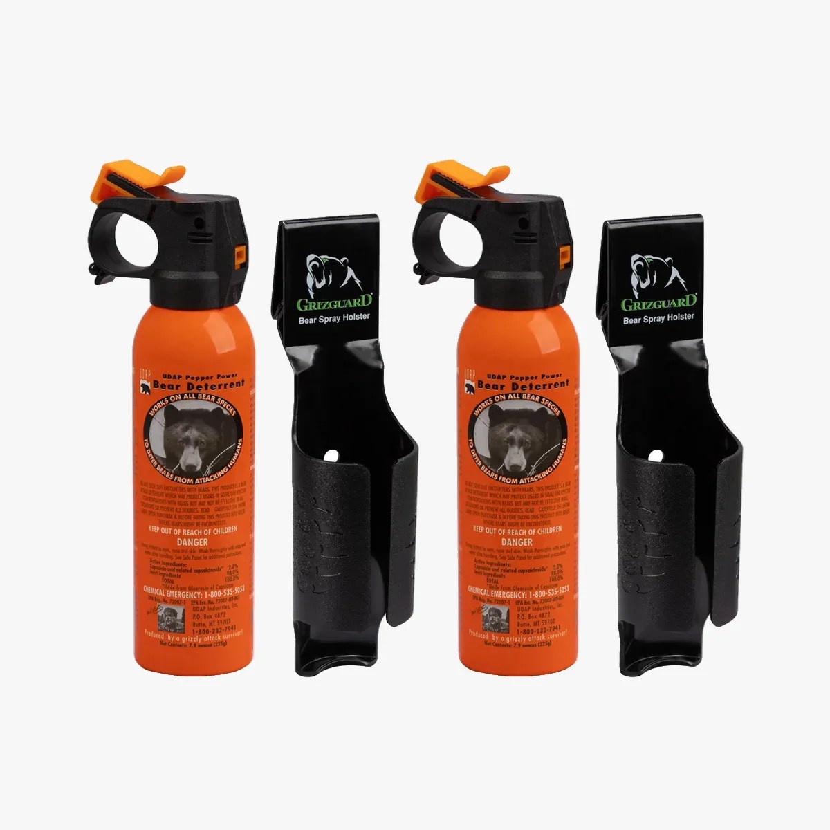 Two orange UDAP Bear Deterrent pepper spray cans with black and orange safety triggers, each paired with a black Grizguard bear spray holster.