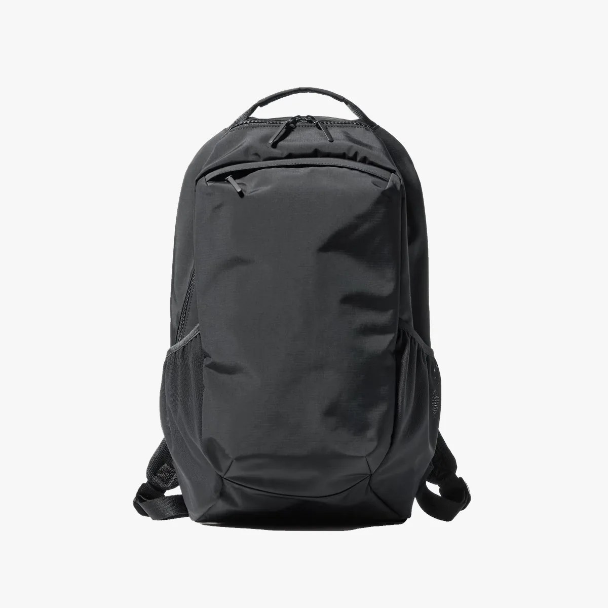 Black backpack with a large front pocket, side mesh pockets, and a top handle.