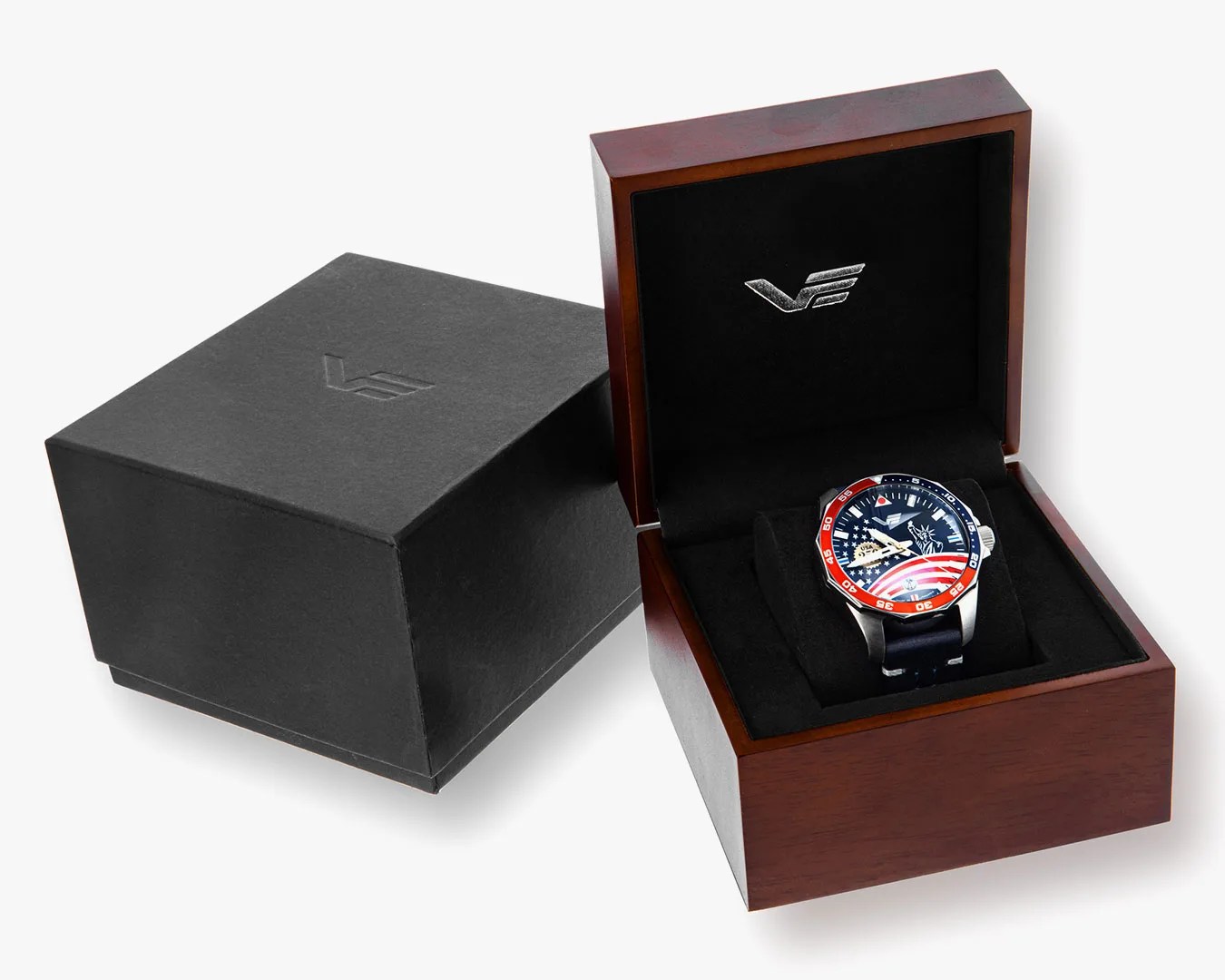 Stainless steel watch with red, white, and blue American flag dial in a wooden display box with black interior.