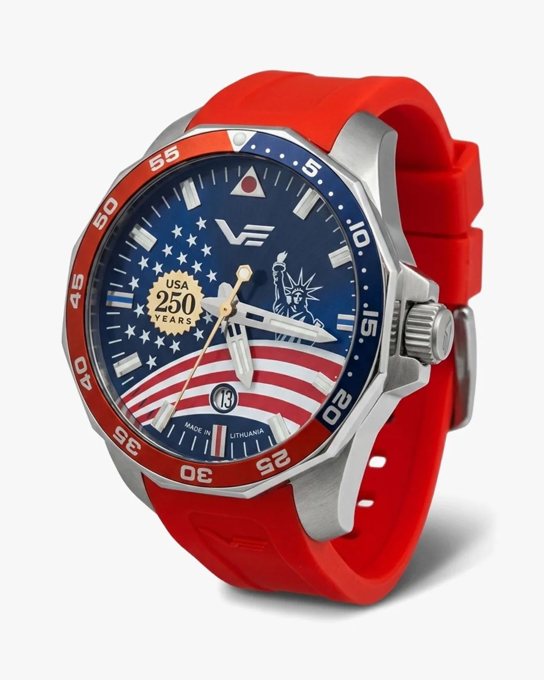 Watch with a red silicone strap, silver case, and blue dial featuring USA 250 years emblem, stars, stripes, and Statue of Liberty.
