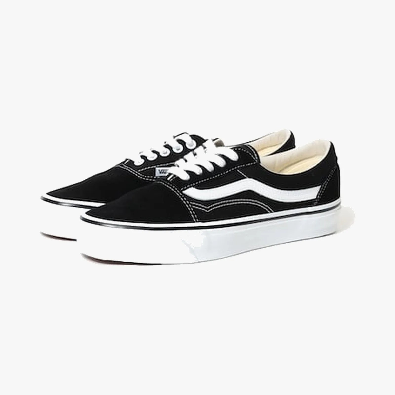 Pair of black Vans sneakers with white side stripe, white laces, and white rubber soles.
