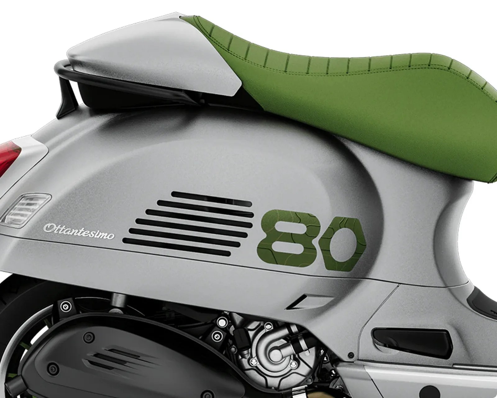 Close-up of a silver scooter with a green seat and "Ottantesimo 80" branding on the side panel.