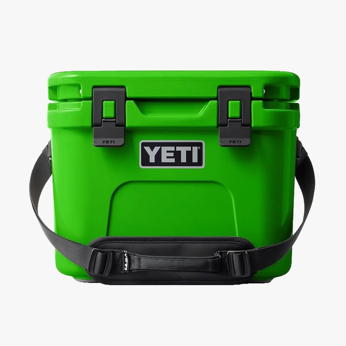 Bright green YETI cooler with black latches and an adjustable black shoulder strap.