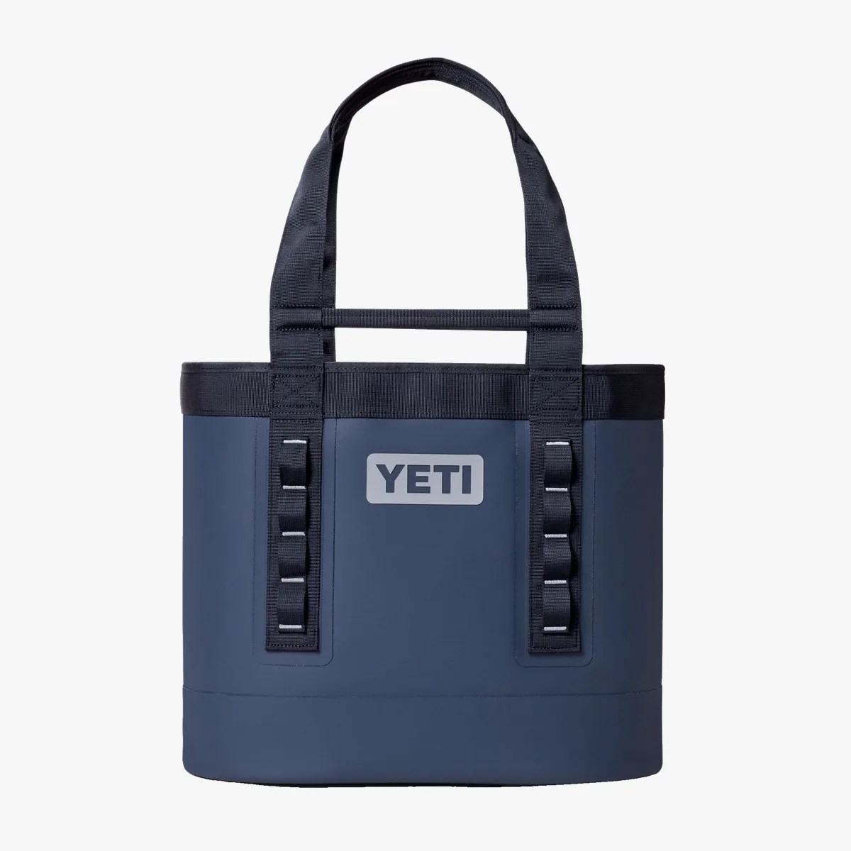 Navy blue YETI tote bag with black handles and loops on a white background.