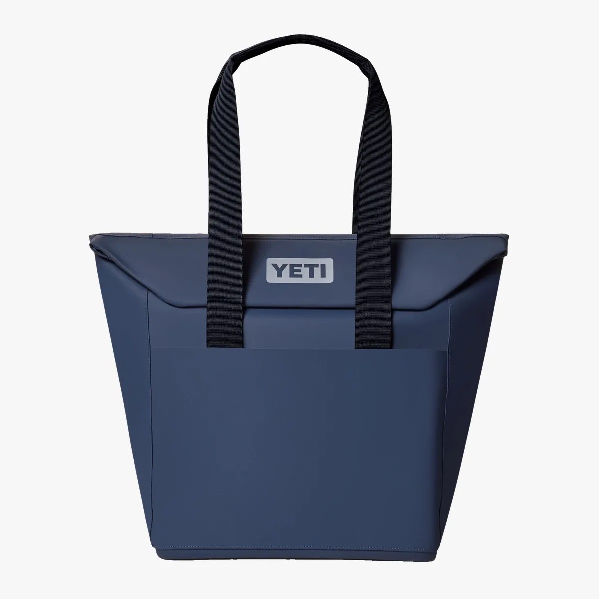 Navy blue YETI tote bag with black handles and front pocket.