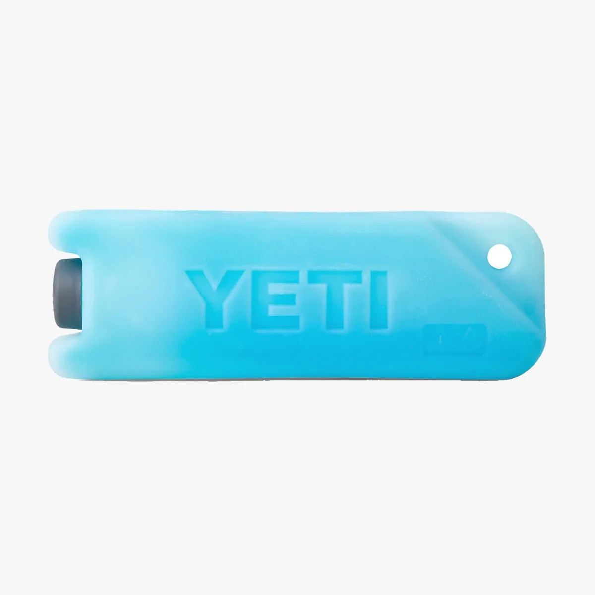 Blue YETI reusable ice pack with a rounded rectangular shape and a small hole on one end.