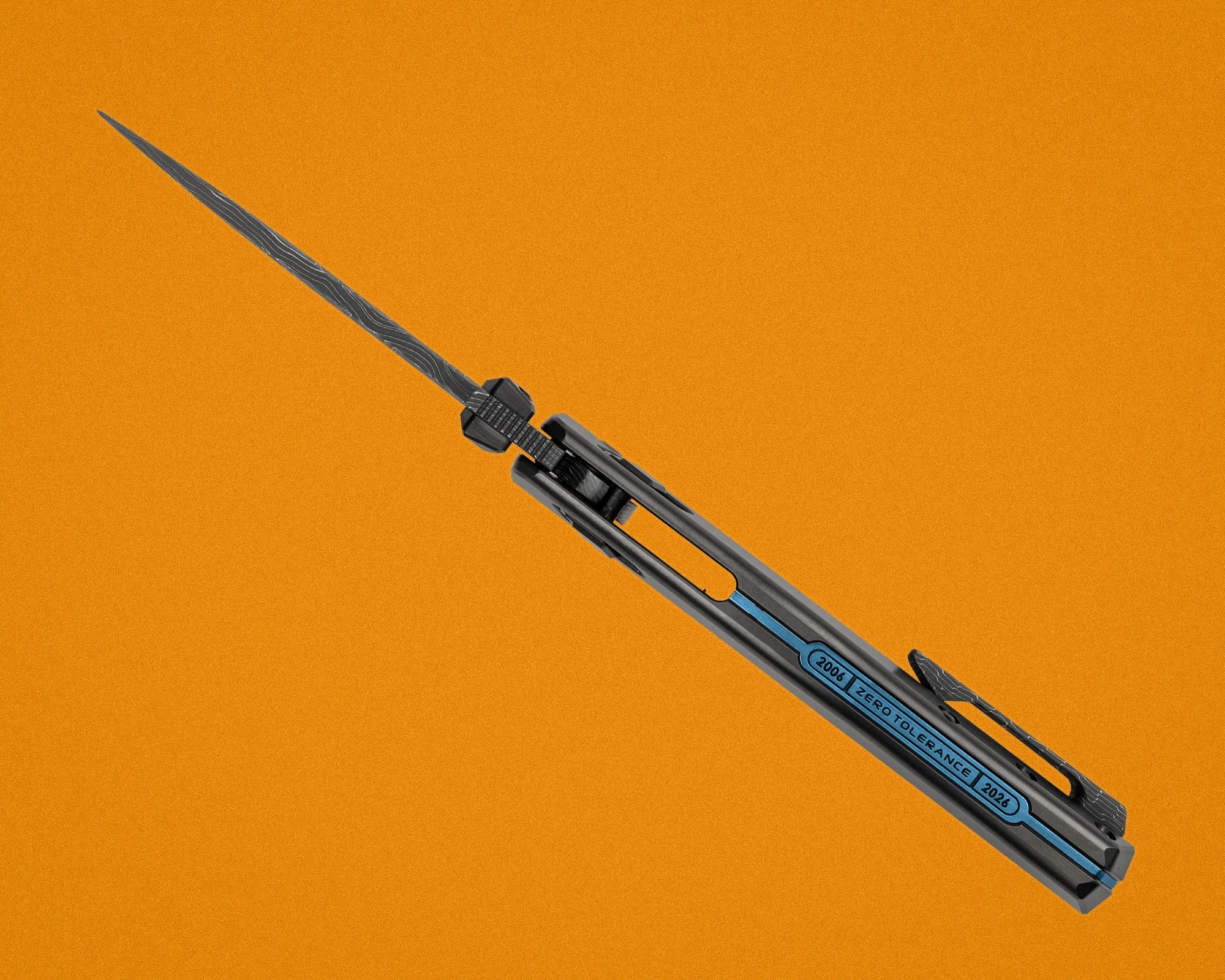 Black folding knife with a patterned blade and blue "2006 Zero Tolerance 2026" label on the handle against an orange background.