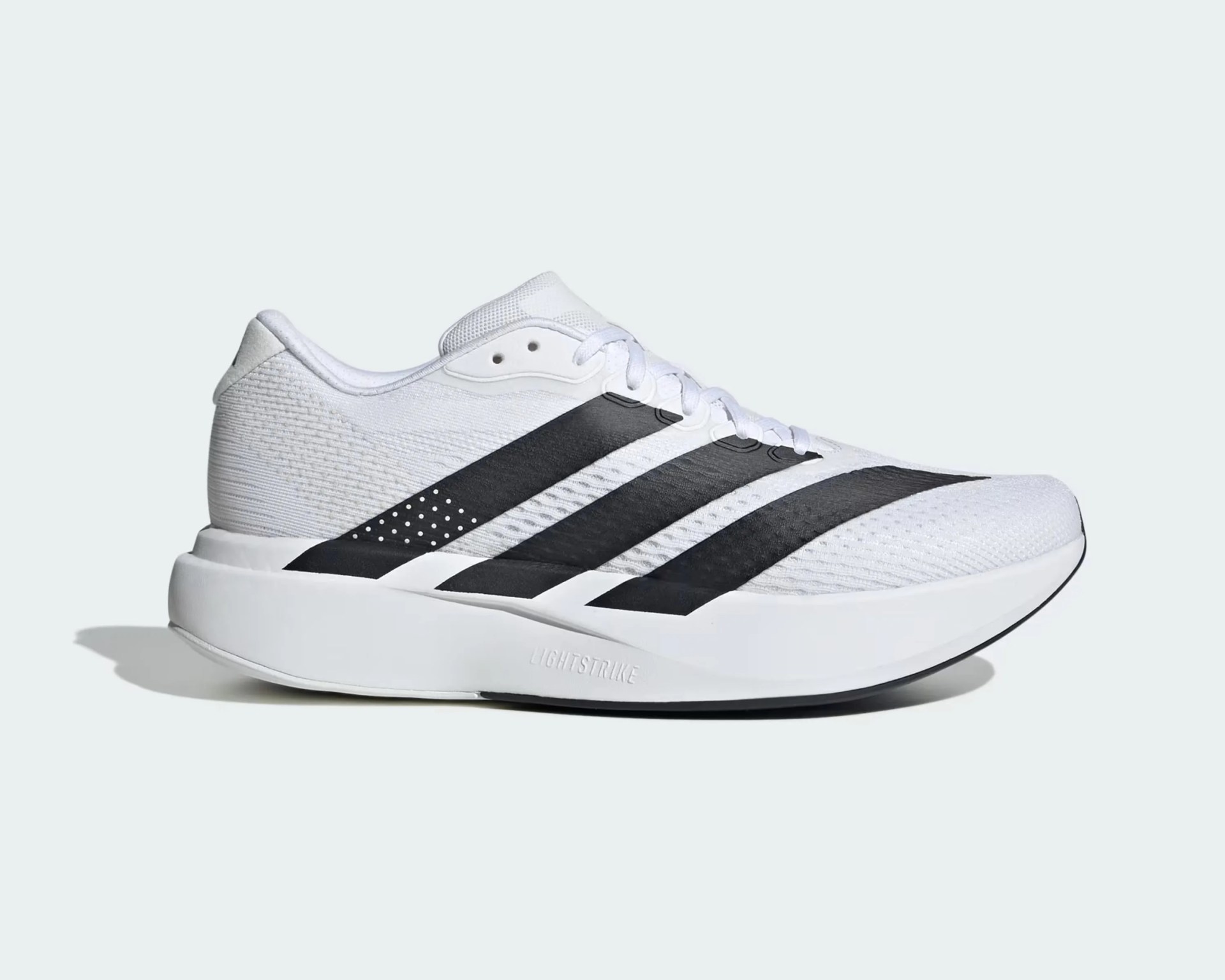 White running shoe with black Adidas stripes and a thick white sole labeled "Lightstrike