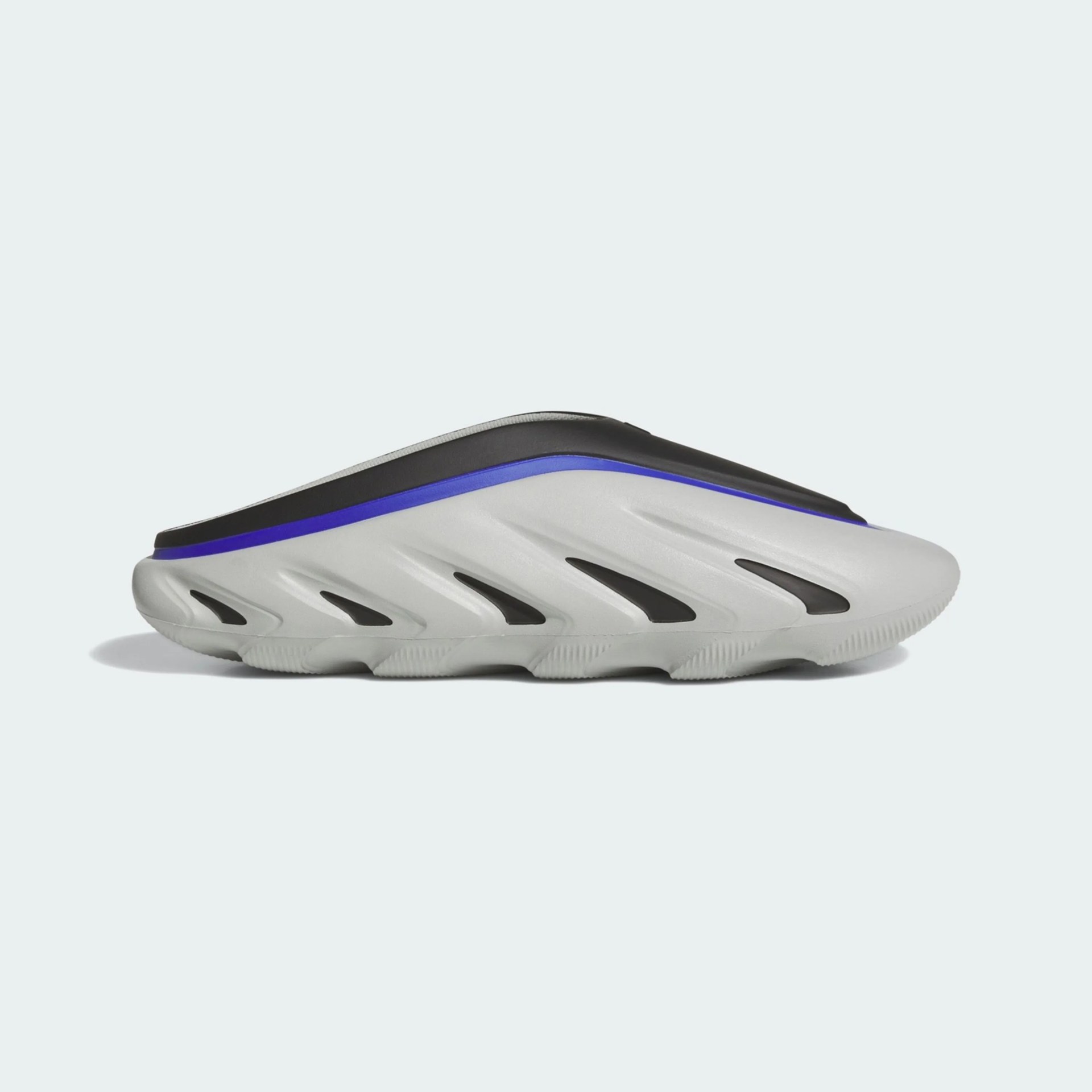 Light gray slip-on shoe with black and blue accents and sculpted sole design.