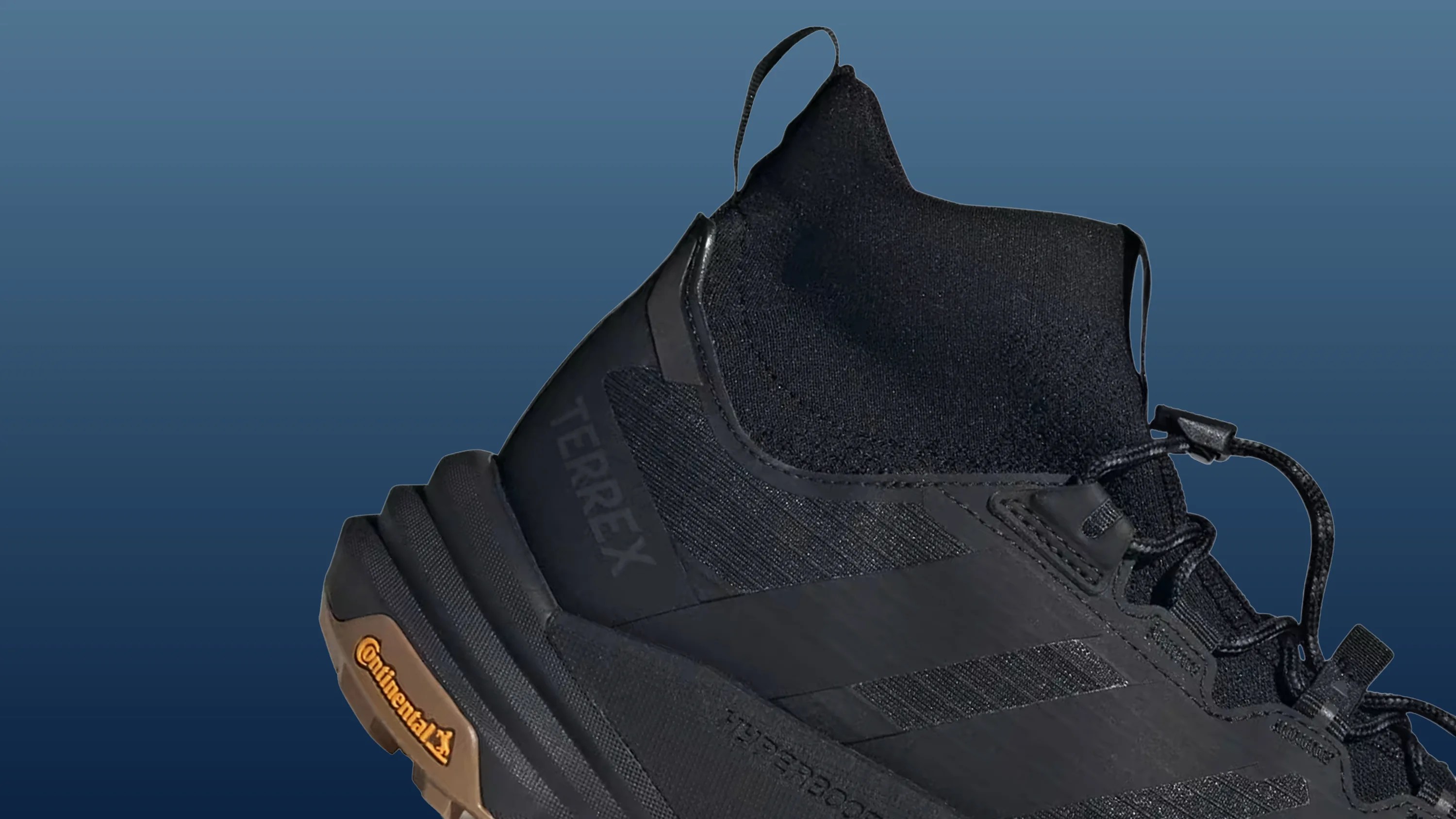 Black high-top Terrex hiking shoe with knit ankle collar and Continental rubber sole.