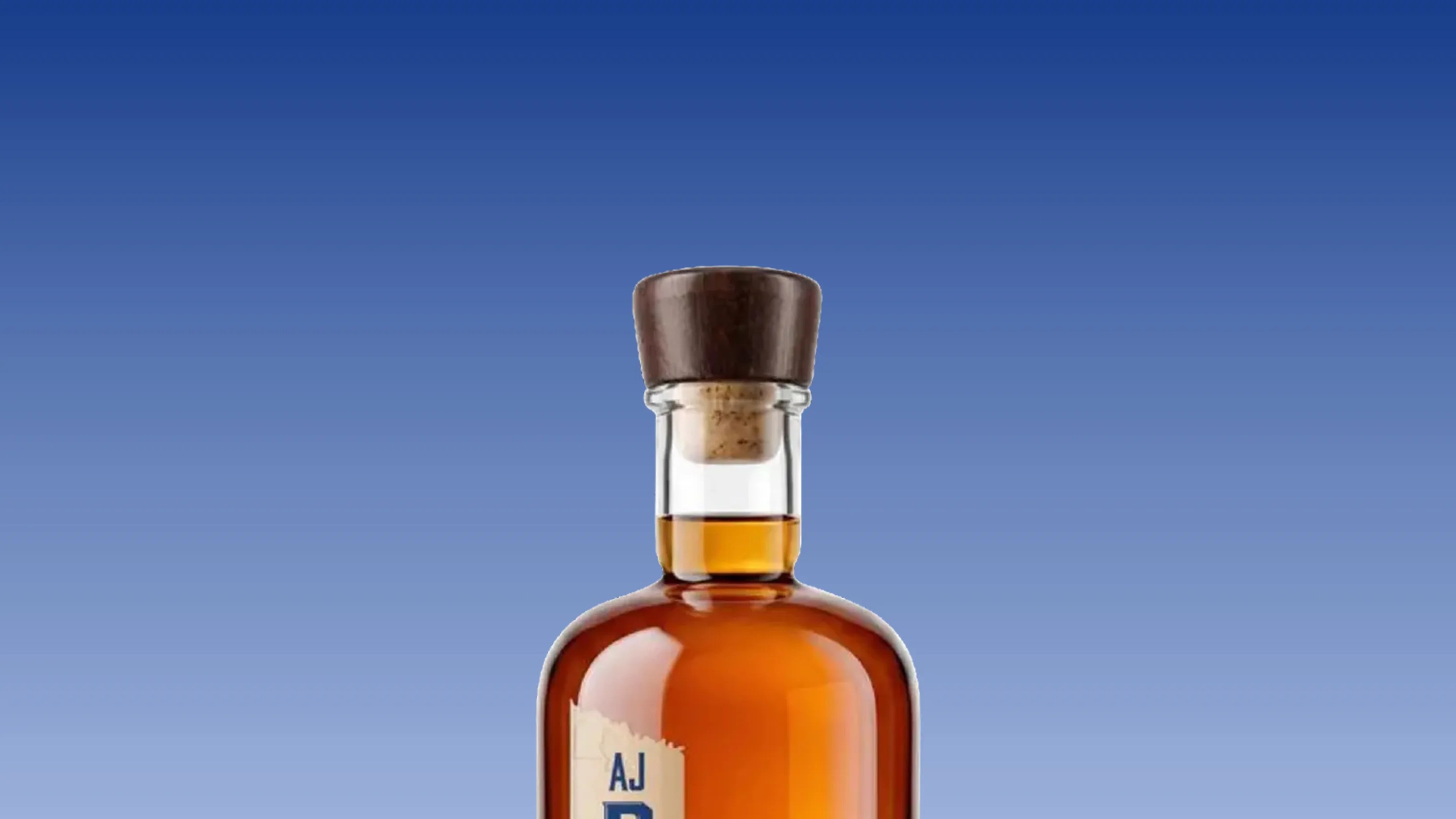 Top portion of an amber glass bottle with a cork and dark wooden stopper against a blue gradient background.