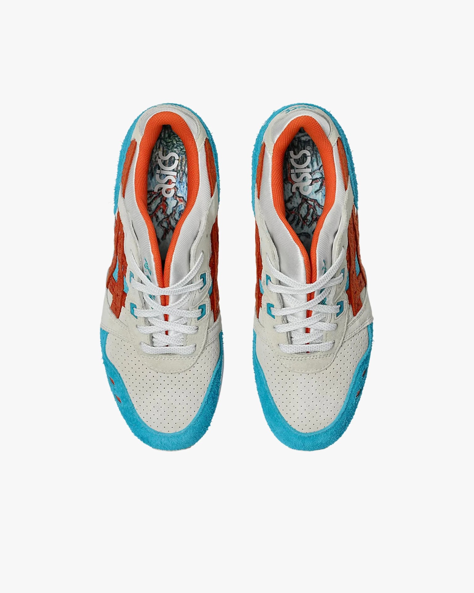 Pair of Asics sneakers with white perforated toe box, orange and blue suede accents, and orange inner lining.