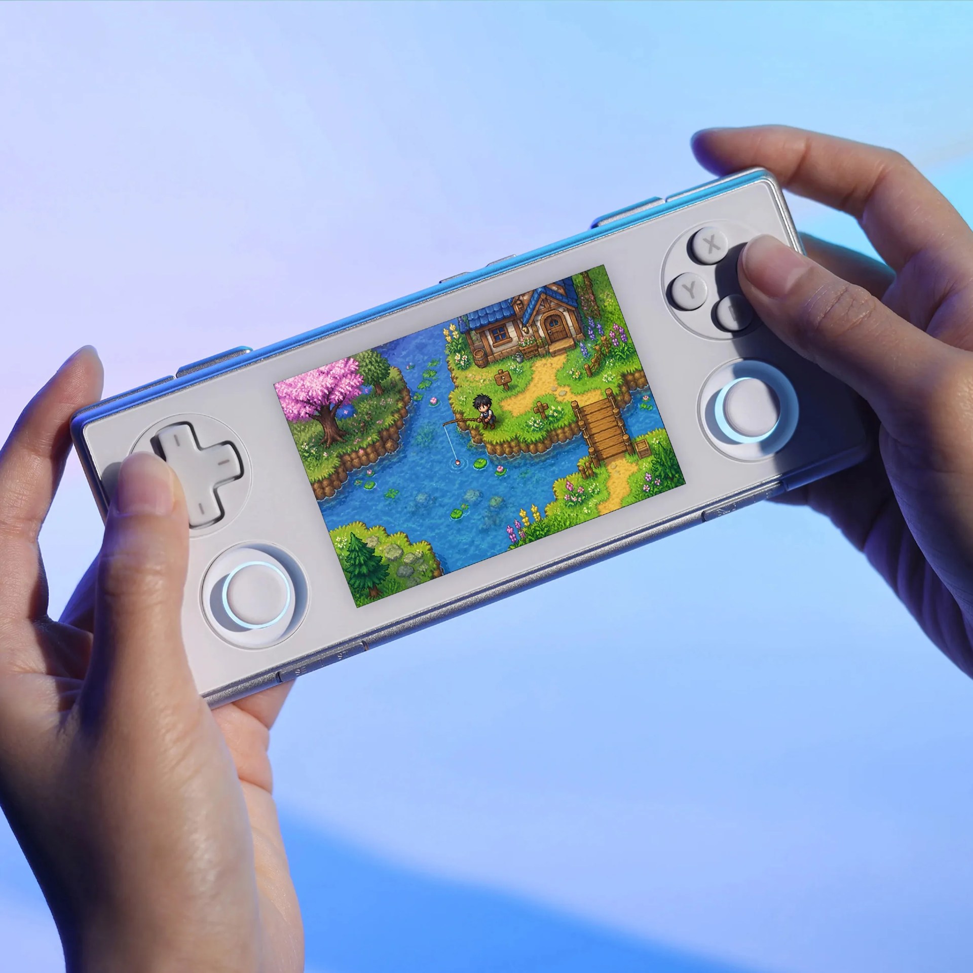 Hands holding a white handheld gaming console with a colorful pixel art game on the screen.