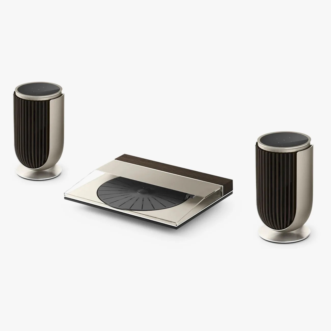 Modern turntable with transparent cover and two matching cylindrical speakers with ribbed black and silver design.
