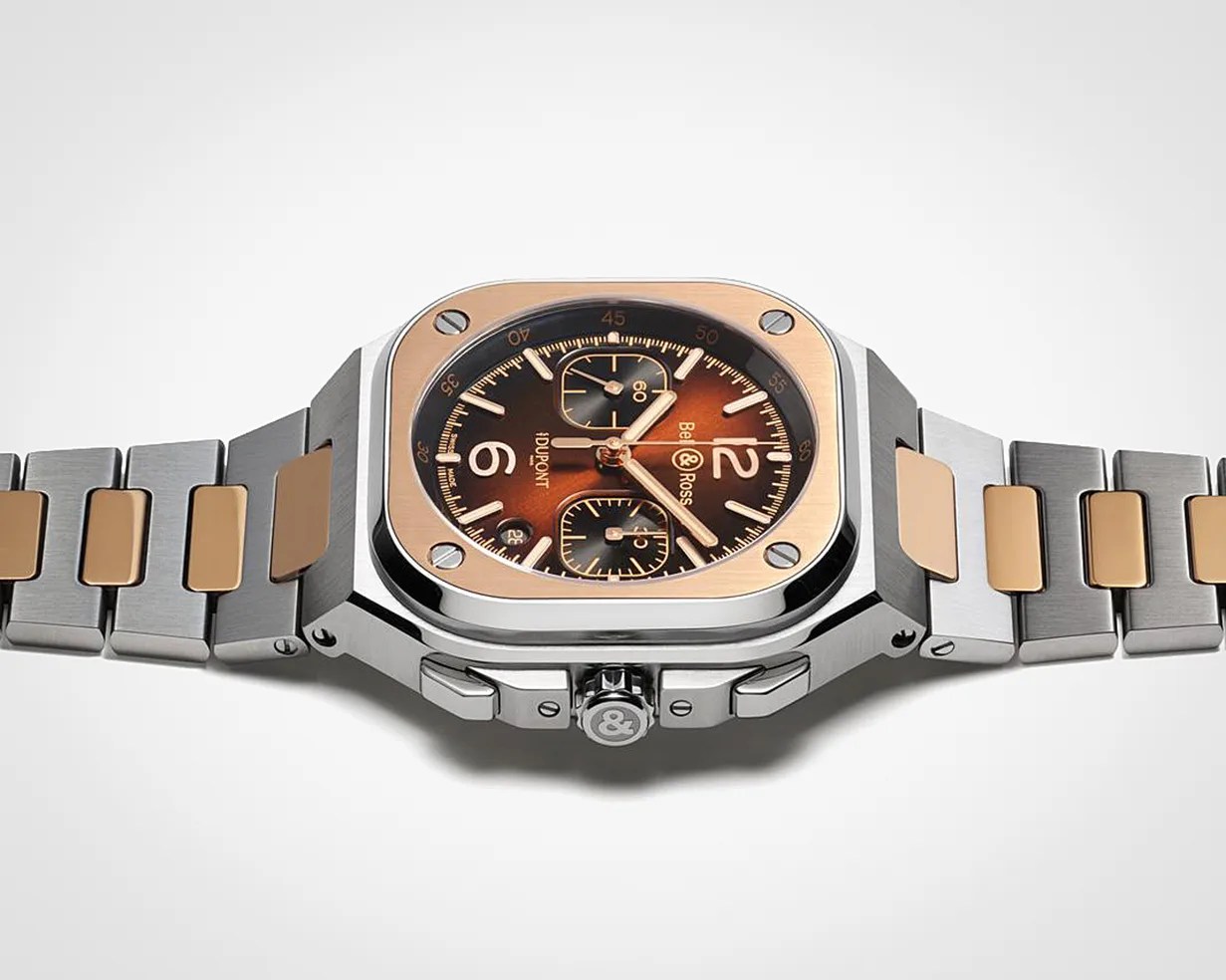 Square stainless steel and rose gold wristwatch with brown dial and chronograph subdials.