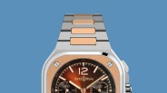 Close-up of a Bell & Ross watch with a silver and rose gold metal bracelet and a brown gradient dial.