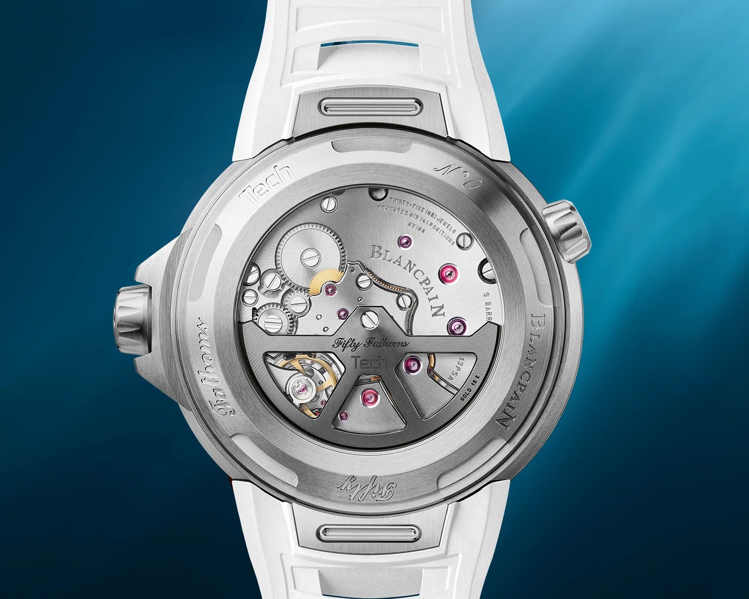 Back view of a Blancpain Fifty Fathoms Tech watch with visible mechanical movement and white strap.