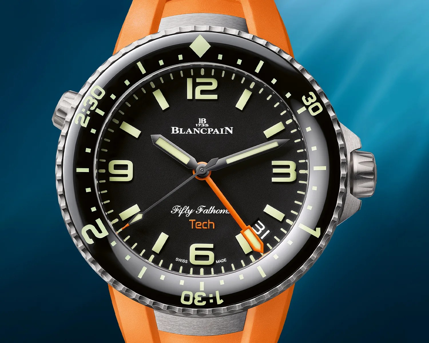 Blancpain Fifty Fathoms Tech dive watch with black dial, luminous markers, orange second hand, and orange strap.
