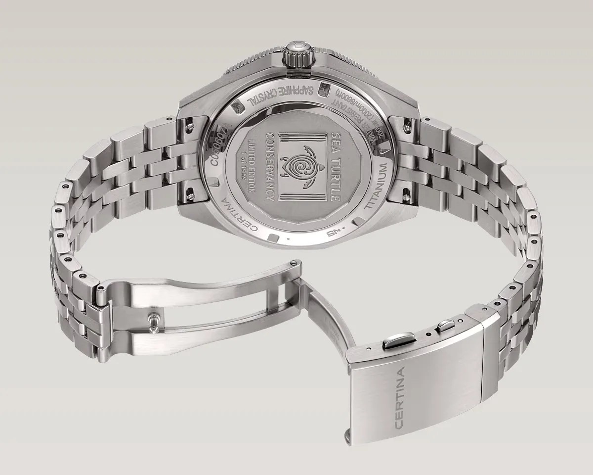 Silver titanium Certina Sea Turtle Conservancy limited edition watch with open clasp showing engraved back.